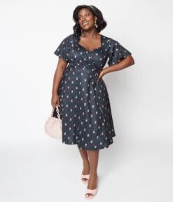 Unique Vintage Curve 1950s Black Tulip Pin Dot Swing Dress